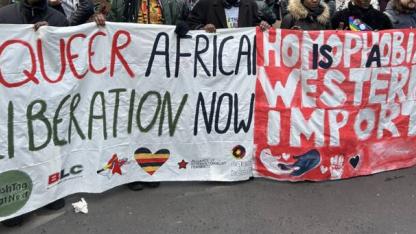 protest banners &quot;Homophobia is a Western Import&quot; und &quot;Queer African Liberation Now&quot;